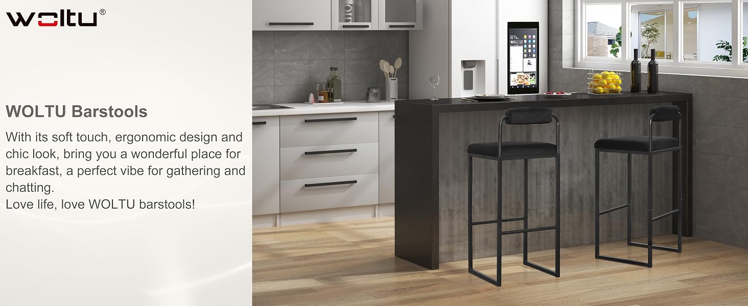 a kitchen with a bar stool and a tv