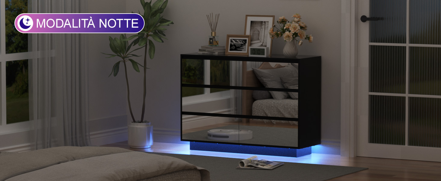 Il testo recita «MODALITA NOTTE». Console di gioco o sistema di intrattenimento con illuminazione ambientale a LED blu visualizzata in camera oscura.