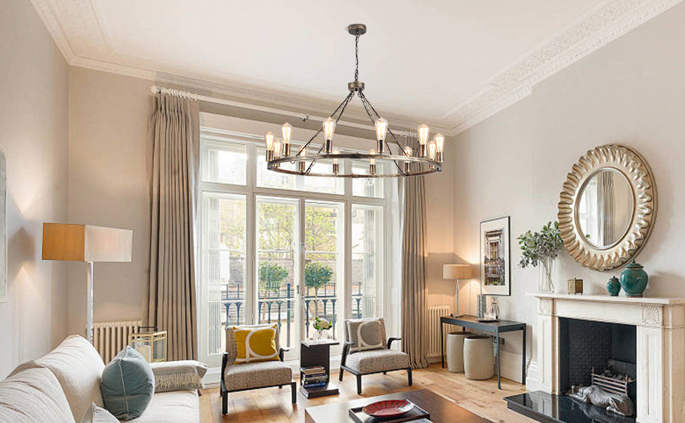 Elegant living room with large chandelier, fireplace, and french doors. Neutral color scheme with beige walls, white trim, and various seating options.