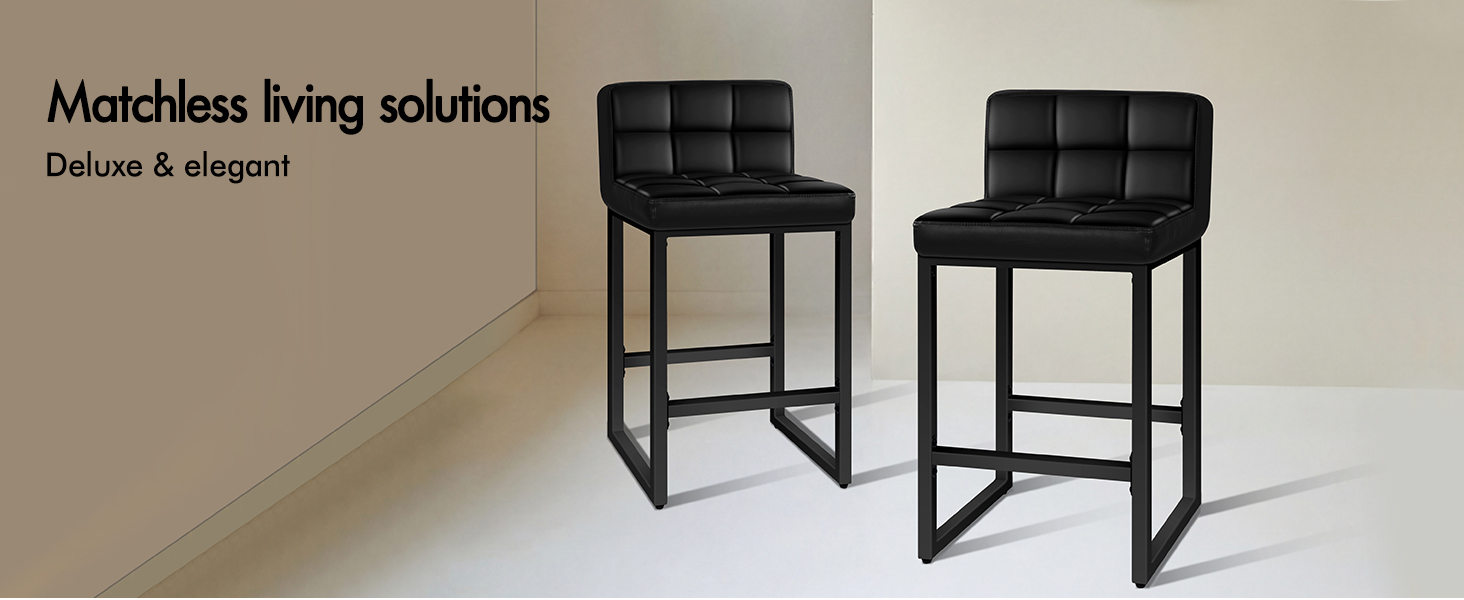 Text reads 'Matchless living solutions' and 'Deluxe &amp; elegant'. Modern black leather bar stools with metal frames displayed in a showroom setting.