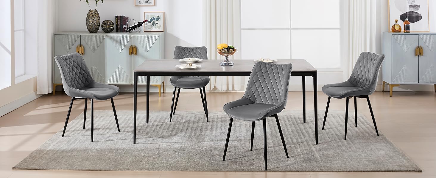 a dining table and chairs in a room.