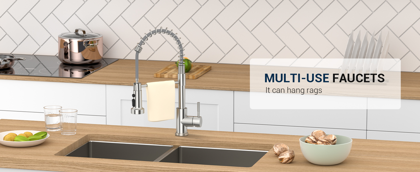 Modern kitchen faucet with flexible pull-down sprayer installed over a dual-basin sink, shown against white tile backsplash and wooden countertop.