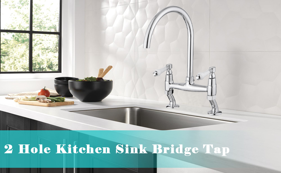 2 Hole Kitchen Sink Bridge Tap installed over stainless steel sink. Chrome finish faucet with dual handles and high arching spout in modern kitchen setting.