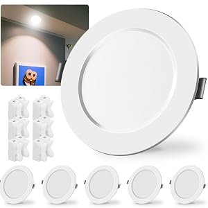 Multiple product views of plain white ceramic dinner plates with rimmed edges, shown individually and stacked together. Clean, minimalist design suitable for formal dining.