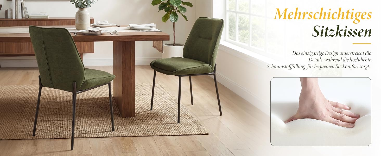 Text lautet „Mehrzweckiges Stühleson“ (deutscher Text sichtbar). Modernes Esszimmer mit Holztisch, grünem Polsterstuhl, Teppich, Topfpflanze und weißen Wänden mit gerahmten Kunstwerken.