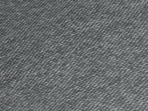 Textura de primer plano de tela tejida o mezclilla gris que muestra un patrón de tejido diagonal