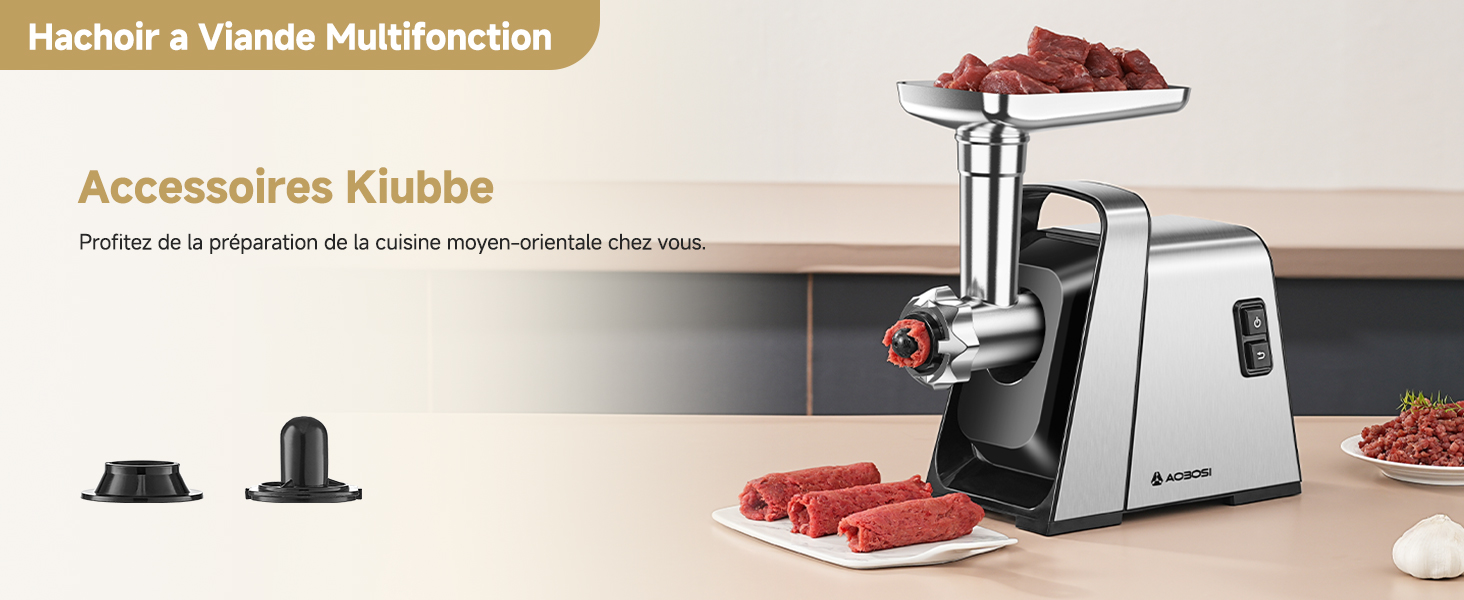 avec corps argenté et touches noires. Affiche la production de viande hachée, les cubes de viande crue et deux accessoires. Le texte indique qu'il s'agit d'un hachoir à viande multifonctionnel.