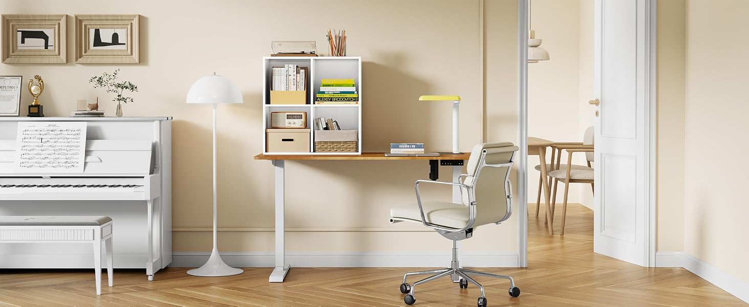 Modern home office space with white piano, height-adjustable desk, ergonomic chair, and built-in wall shelving in a bright interior setting.
