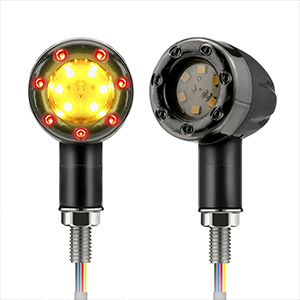 Two motorcycle turn signal lights with black housings, one illuminated with amber LEDs, the other showing the internal circuitry.