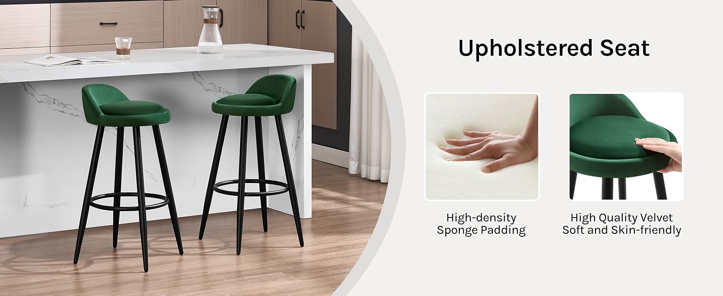 Two green upholstered bar stools with black legs, shown in a kitchen setting. Inset images demonstrate high-density sponge padding and velvet upholstery for comfort and durability.