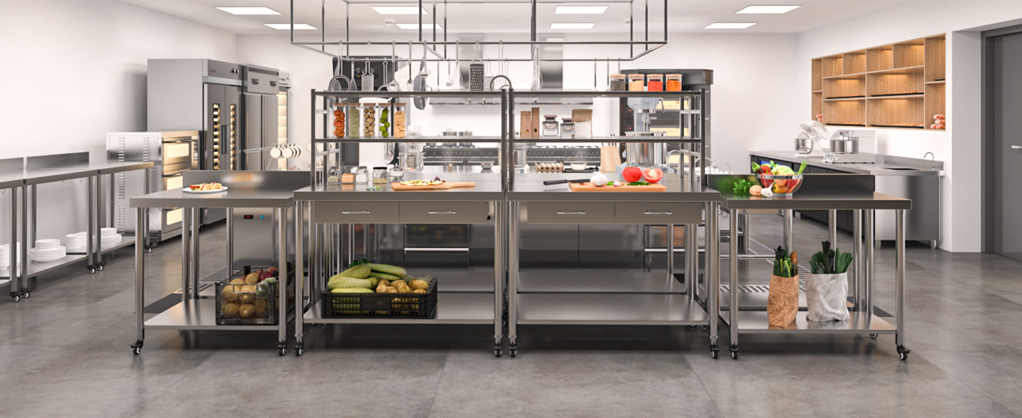 Commercial kitchen interior with stainless steel preparation tables, storage racks, and display cases in organized layout with bright lighting.
