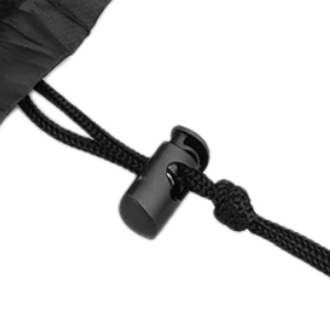 Close-up of a black cord or cable with a small cylindrical attachment, possibly an audio device or microphone.