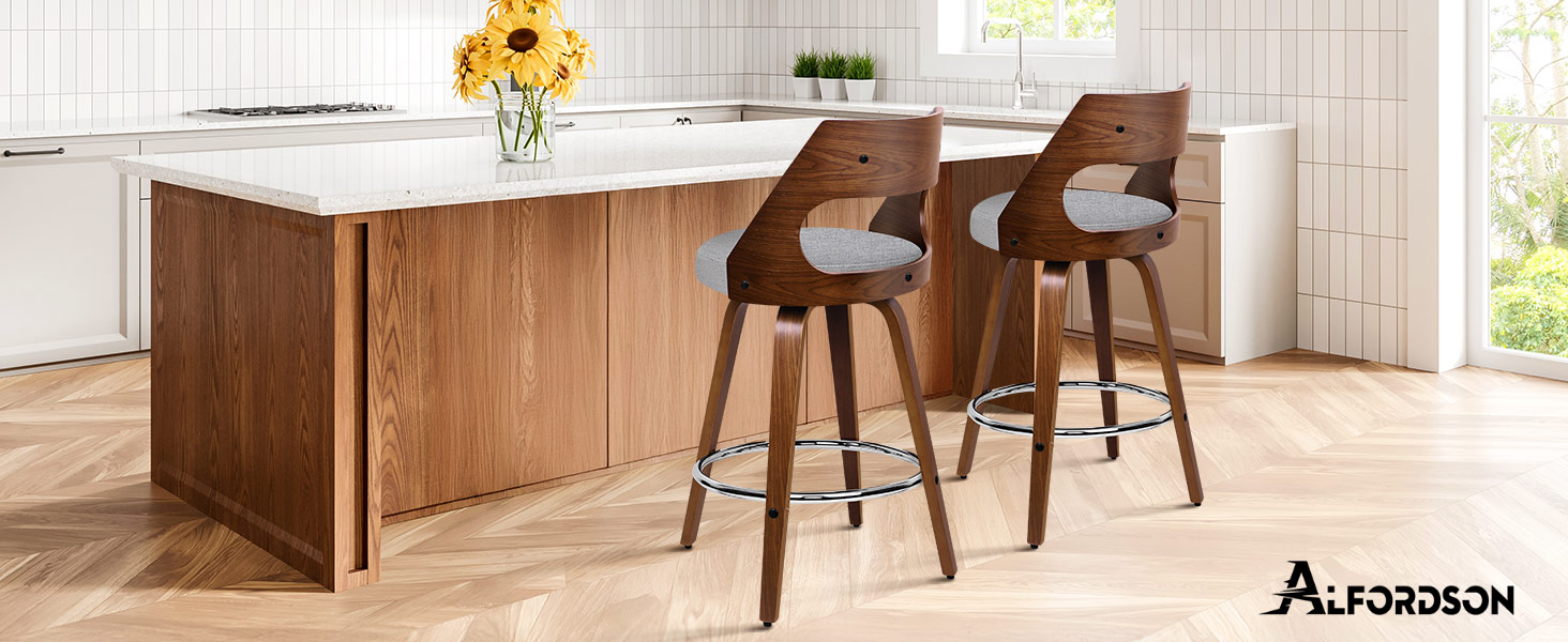 Text reads 'Artcasson'. Modern kitchen interior with wooden cabinets, island counter with bar stools, and minimalist design elements.
