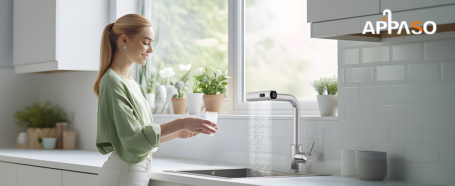 Modern kitchen faucet with running water spray, installed above sink with potted herbs on windowsill. APPA.O branding visible.