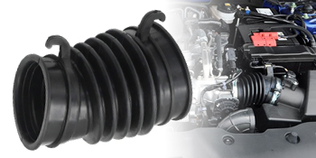 Close-up black and white image of a rubber or plastic accordion-style dust boot or bellows component.