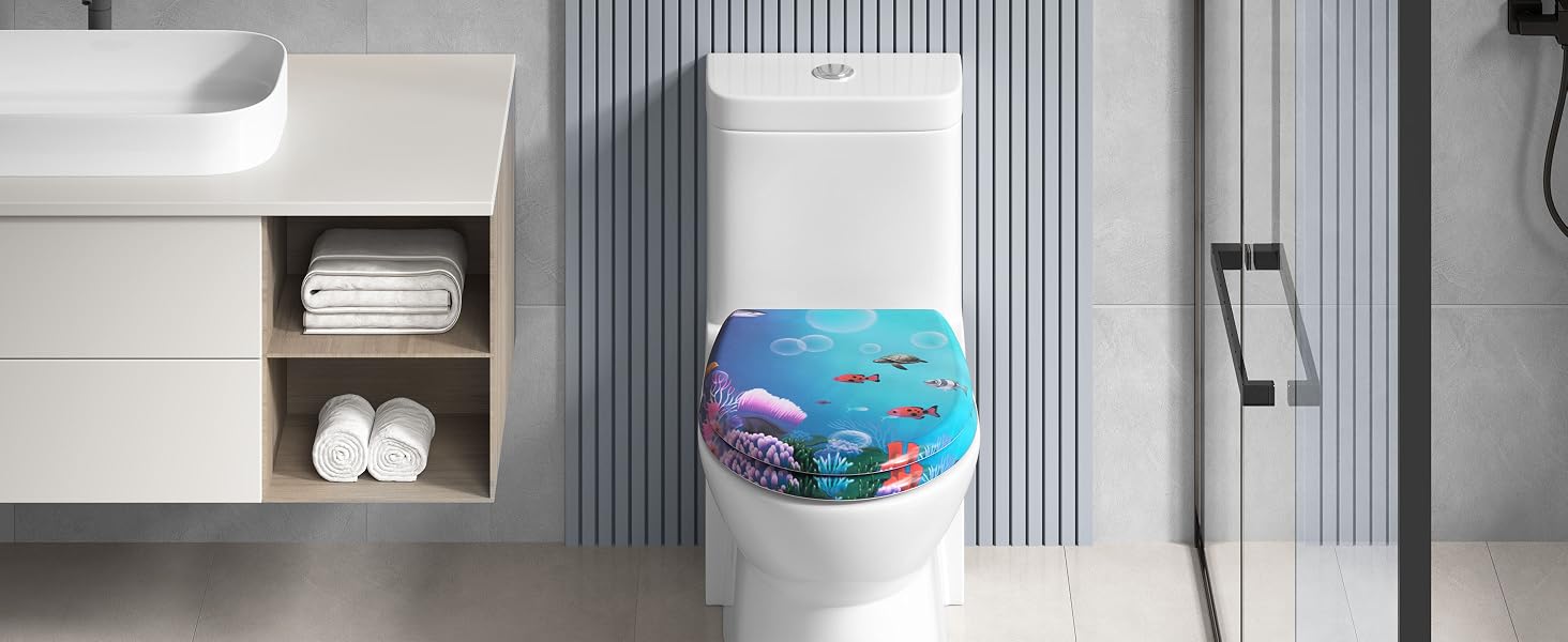 Contemporary bathroom setting featuring white toilet with decorative blue ocean-themed toilet seat lid and built-in storage shelving.