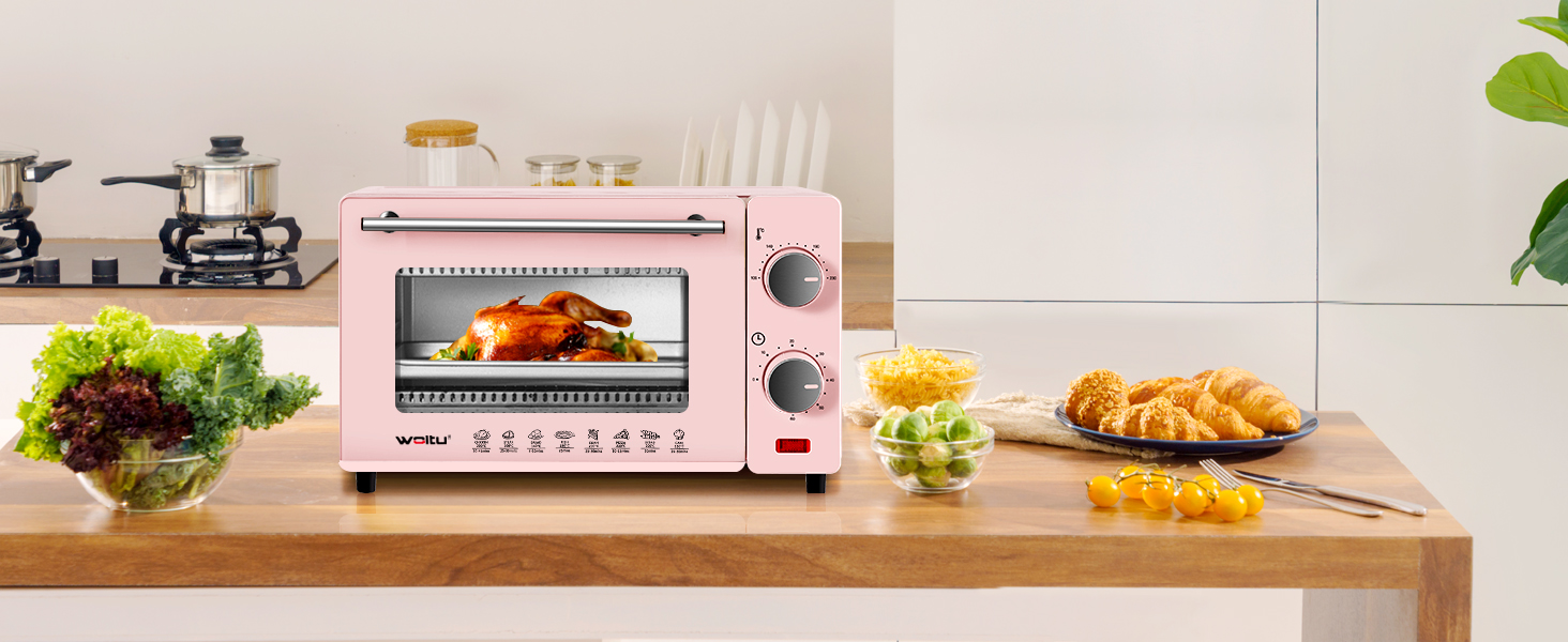 un forno rosa con un tostapane su un bancone