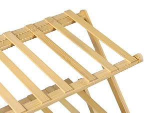 Wooden folding luggage rack with slatted top and X-frame legs, suitable for supporting suitcases or bags.