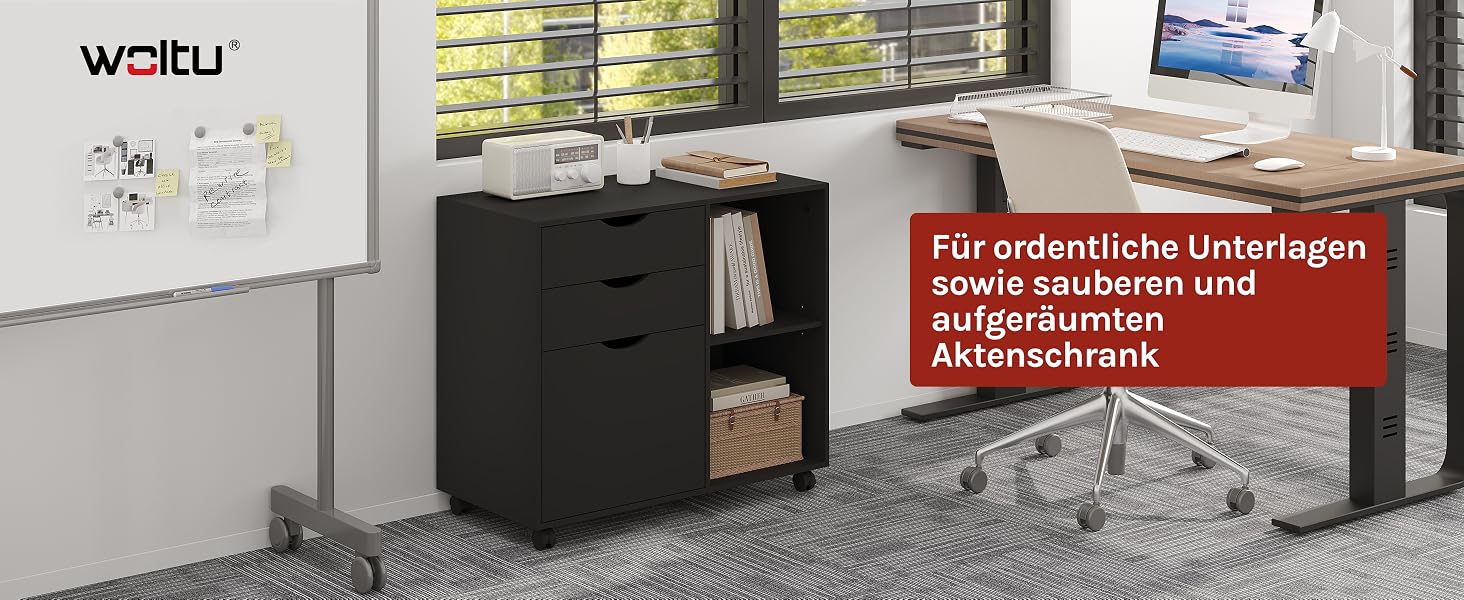 Schwarzer Schreibtisch mit Schubladen, dargestellt in einer Heimbüroumgebung mit sichtbarem Whiteboard und Computerbildschirm