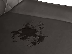 a close up of a chair with a water stain on it.
