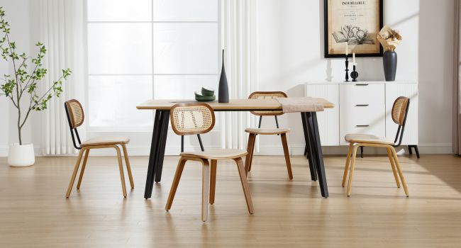 Modern dining set with light wood table, black metal legs, and four chairs. Two chairs have woven rattan backs, two have solid wood backs. Minimalist room decor.