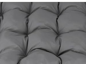Tejido acolchado gris con detalles de botones capitoné que crean un patrón de diamantes en toda la superficie. Material de tapicería suave con acolchado dimensional y textura cosida.