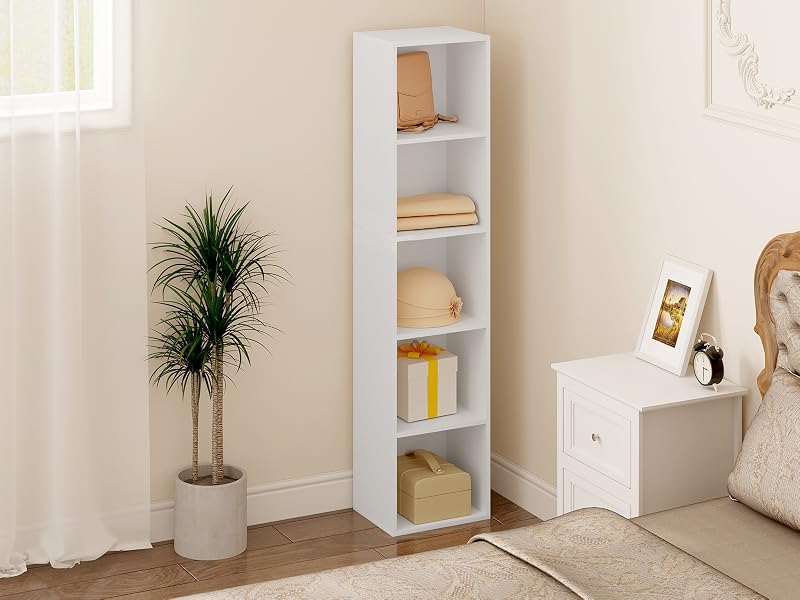 Tall white bookshelf with five shelves in a minimalist room setting. Potted plant and other decor items visible nearby.