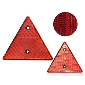 Red reflective warning triangles with metal mounting points. Close-up detail of reflective mesh texture pattern shown in circular inset.
