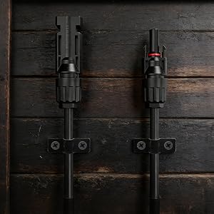Series of industrial-style black metal barn door hardware mounted on dark wood surfaces, showing different sliding positions and installation views.