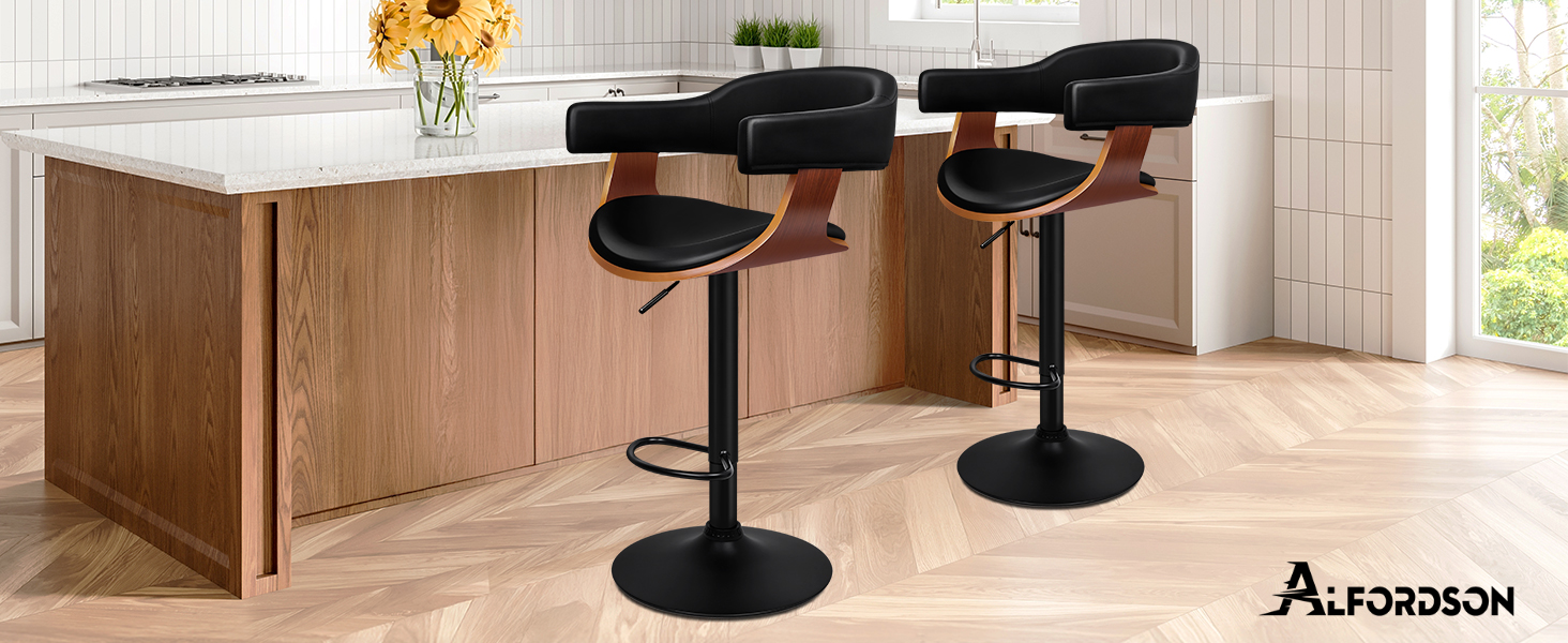 Interior design scene showing modern black bar stools arranged along a wooden counter or bar area in what appears to be a contemporary home setting.