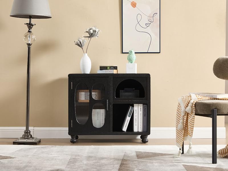 Black storage cabinet with mesh doors, positioned beside a floor lamp. Contains shelves for organization, with books and decorative items visible inside.