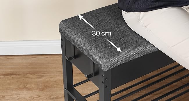 Black rectangular storage bench with measurement annotation '30 cm' indicating width, positioned against wooden slatted base.
