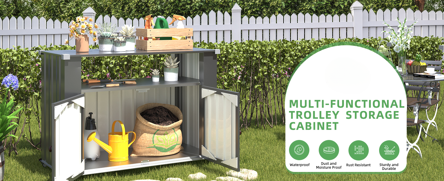 Outdoor storage cabinet with two shelves, displaying gardening tools and supplies. Gray exterior, white picket fence background.