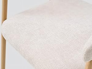 Les détails de texture rapprochés d'un tissu blanc ou crème semblent être un textile tissé avec un aspect de fibre naturelle et un motif rayé subtil visible.