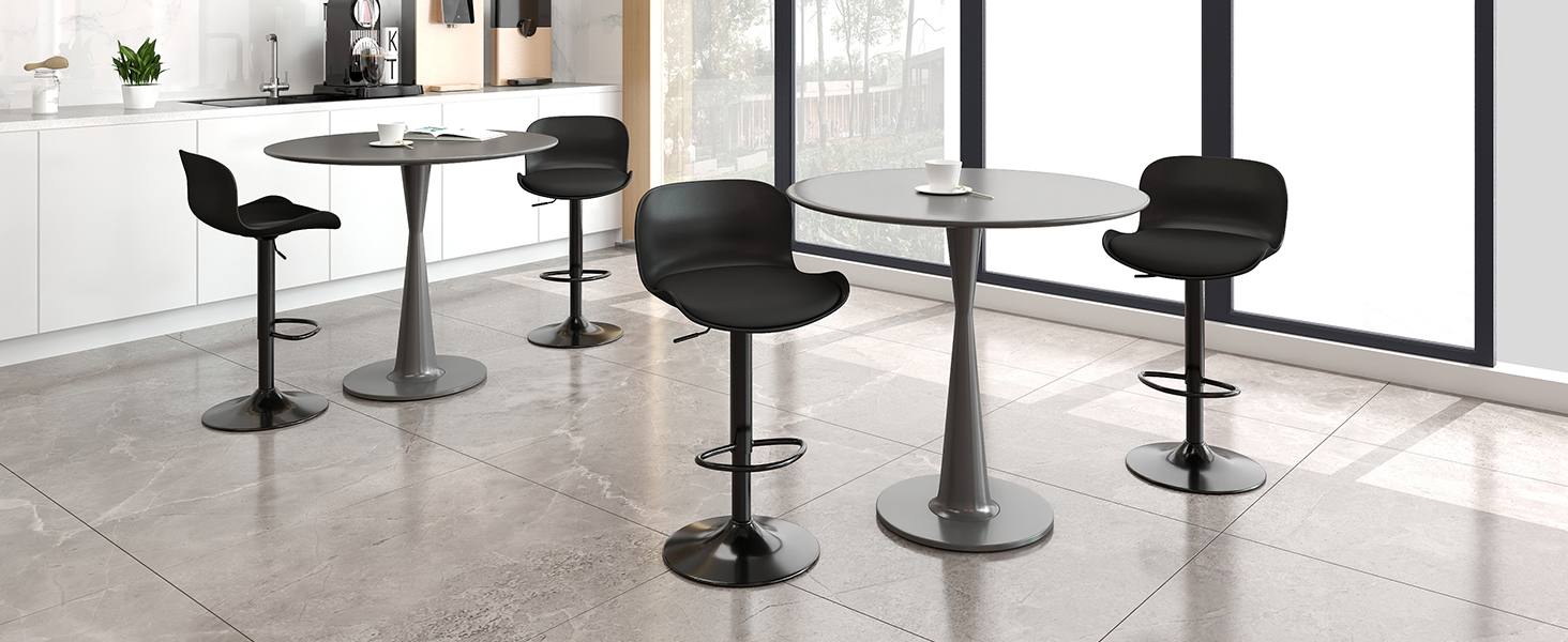 Modern commercial space with multiple black adjustable bar stools arranged in a row along a minimalist counter area with polished concrete flooring.