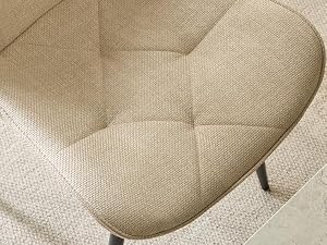 Détail rapproché d'un tissu texturé beige ou d'un matériau de coussin montrant le motif de coutures matelassées et la texture de la surface des meubles rembourrés.