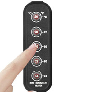 Black rectangular device with temperature settings displayed. Shows numbers from 28 to 34 degrees, with a finger touching one button.