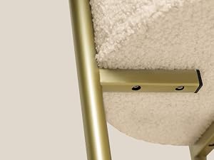 Close-up sequence showing installation details of a gold-colored mounting bracket or hardware component against a beige textured surface.
