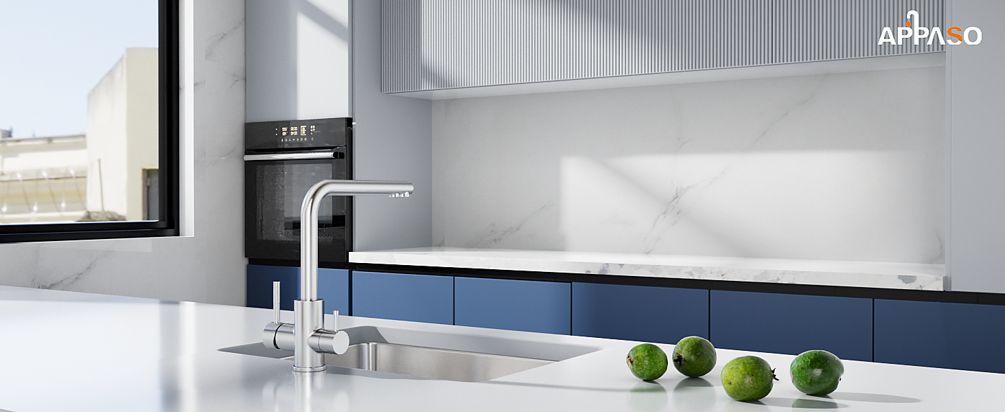 Modern kitchen interior featuring white countertop with chrome faucet, navy blue lower cabinets, and textured wall panels. Three green limes displayed.