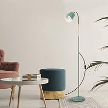 Mint green floor lamp with adjustable head, positioned near a teal accent chair and round side table in a minimalist living space setting.