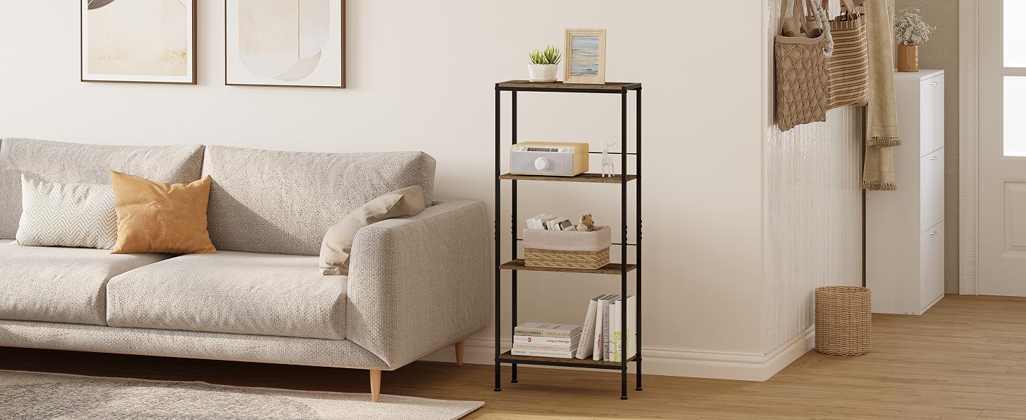 Four-tier metal shelving unit with dark frame and light shelves, displayed in a living room setting next to a gray sofa and decorative items.
