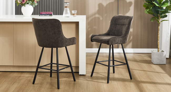 Modern dining chairs with dark gray upholstery and black metal legs shown in various angles within a bright interior setting.