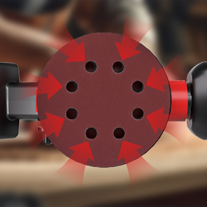 Primer plano de un disco de lijado circular rojo con múltiples orificios perforados dispuestos en un patrón simétrico.