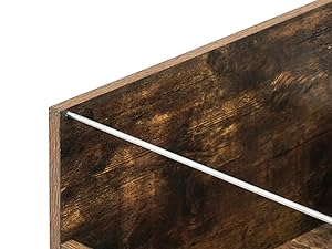 Corner detail of a wooden shelf or storage unit with a dark stained finish, showing an internal divider or partition.