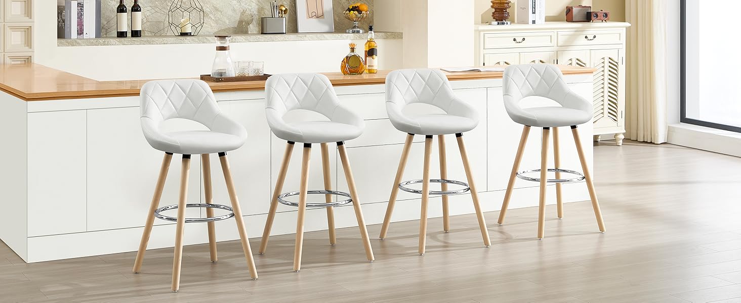 a white bar stool with a white leather seat.