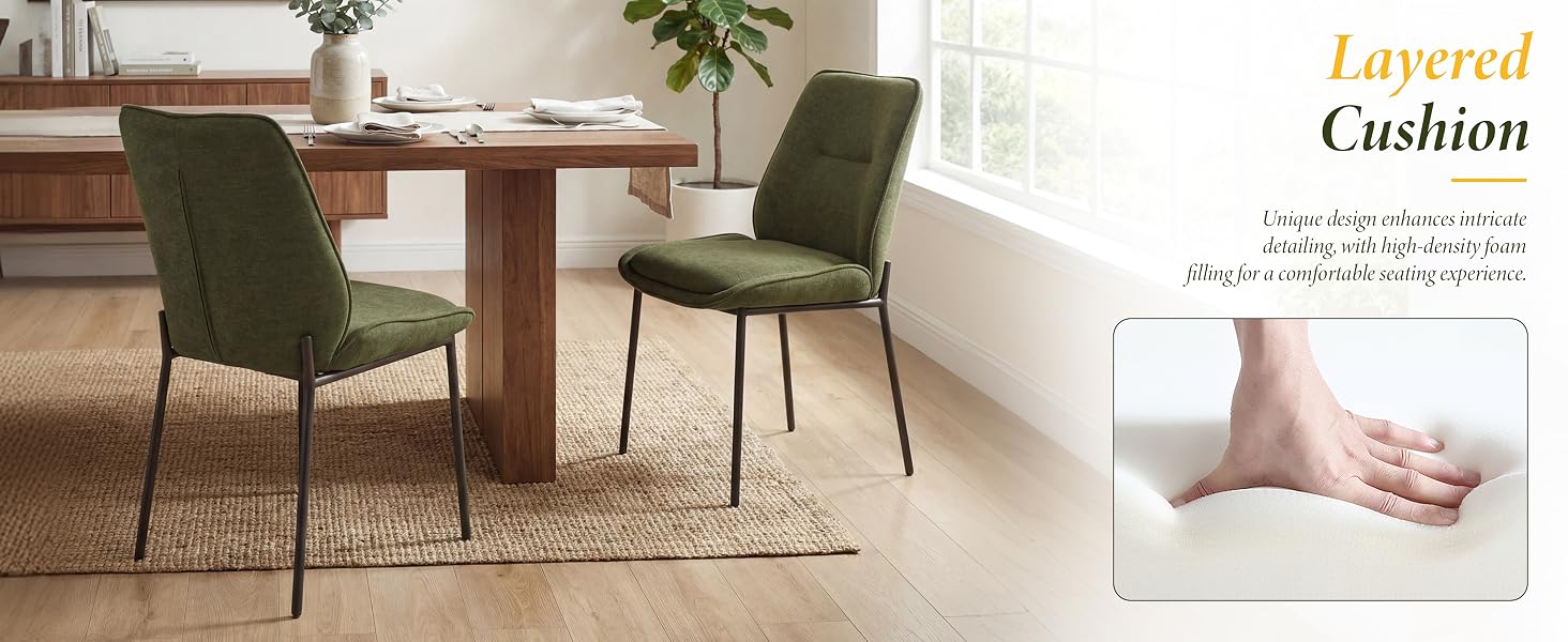Text reads 'Layered Cushion'. Dining room scene with wooden table, two olive green upholstered chairs, and area rug. Inset shows close-up of ankle/foot on cushioned surface.