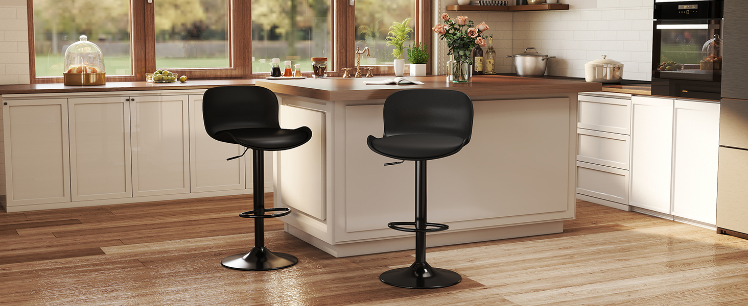 Modern home bar setup with wood flooring, featuring black bar stools and counter space. Shows interior design perspective of contemporary bar area.