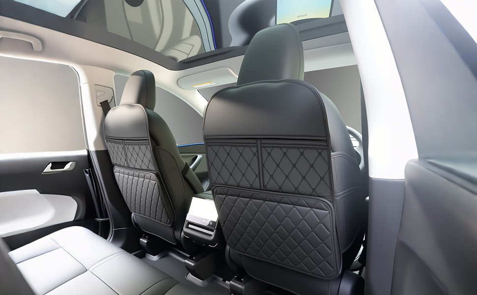 Interior view of vehicle seats showing black upholstery with diamond-pattern stitching across multiple rows of seating.