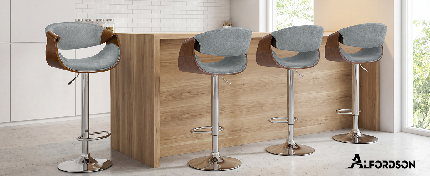 Text reads 'AUTODESIGN'. Modern bar stools with grey upholstery and chrome bases shown in kitchen setting with wooden elements.