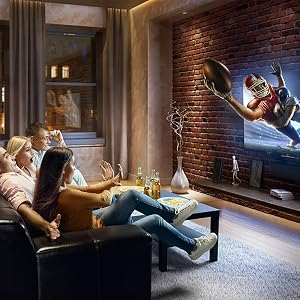 a family watching a football game on tv.